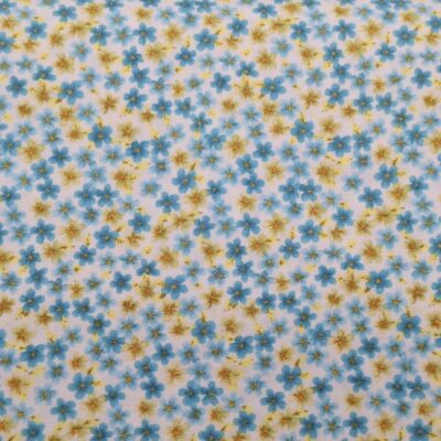 tela de algodón tipo patchwork estampada con florecitas azules y amarillas