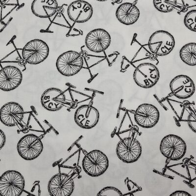 Tela de algodón tipo patchwork con fondo blanco, estampada con bicicletas negras