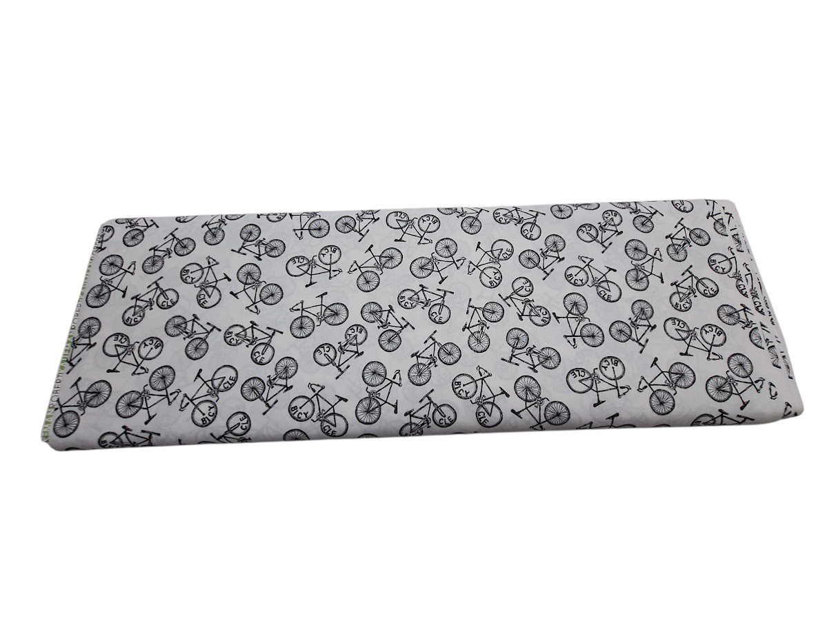 Tela de algodón tipo patchwork con fondo blanco, estampada con bicicletas negras
